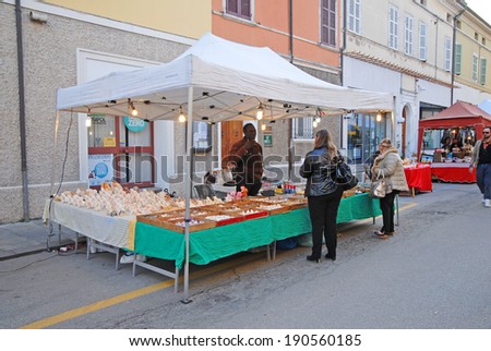 RUSSI, RAVENNA, ITALY- MARCH 30, 2014: sea shells vendor at the Seven Sorrows annual fair. The exhibition is very popular in the city and attracts thousands of people.