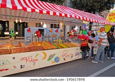 RUSSI, RAVENNA, ITALY- SEPTEMBER 16, 2012: sweets vendor at the Seven Sorrows annual fair. The exhibition is very popular in the city and attracts thousands of people