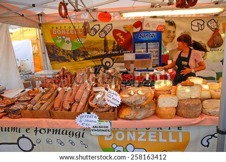 CERVIA, ITALY-SEPTEMBER 21, 2014: salami and cheese stand at the annual International food outdoor market. This market is very popular and attract thousands of tourists.