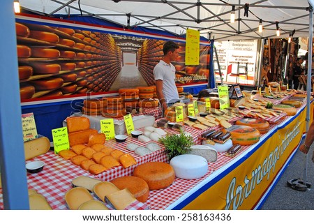 CERVIA, ITALY-SEPTEMBER 21, 2014: cheese  stand at the annual International food outdoor market. This market is very popular and attract thousands of tourists.