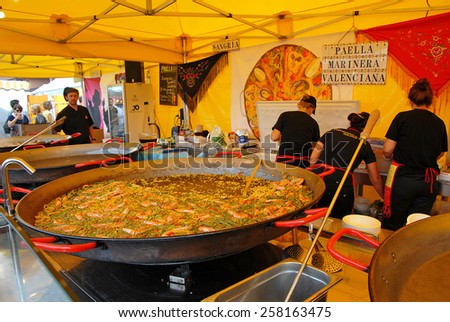CERVIA, ITALY-SEPTEMBER 21, 2014: Spanish paiella stand at the annual International food outdoor market. This market is very popular and attract thousands of tourists.