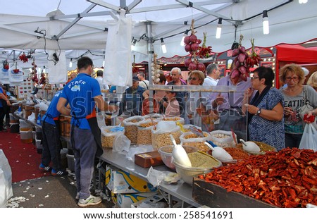 CERVIA, ITALY-SEPTEMBER 21, 2014: biscuit stand at the annual International food outdoor market. This market is very popular and attract thousands of tourists.