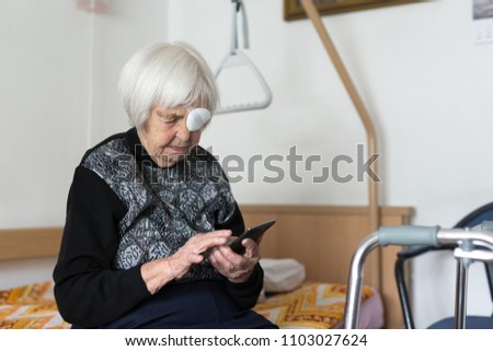 Similar – Image, Stock Photo Lonley elderly 95 years old woman sitting at the bad using modern mobile phone.