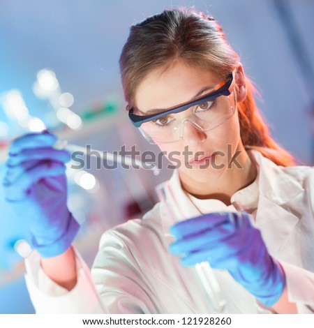 Similar – Image, Stock Photo Young scientist pipetting solution.