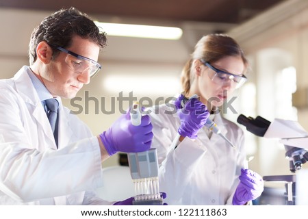 Similar – Image, Stock Photo man pipetting in the laboratory