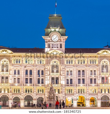 The City Hall, Palazzo del Municipio, is the dominating building on Trieste\'s main square Piazza dell Unita d Italia. Trieste, Italy, Europe. Illuminated city square shot at dusk.
