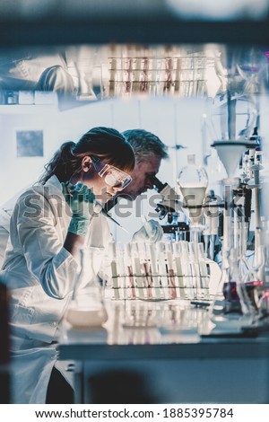 Similar – Foto Bild Nachwuchswissenschaftler pipettieren im Labor für Biowissenschaften.