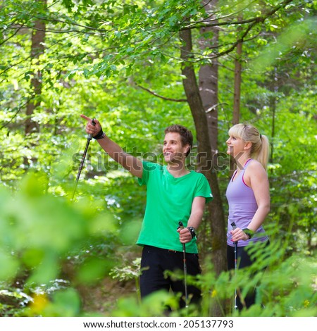 Similar – Image, Stock Photo Young spoty active cople biking in nature. Active lifestyle. Activities and recreation outdoors.