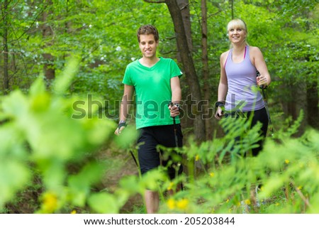 Similar – Image, Stock Photo Young spoty active cople biking in nature. Active lifestyle. Activities and recreation outdoors.