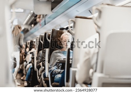 Similar – Image, Stock Photo Young woman going for a bicycle ride in the park