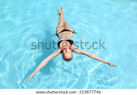 Image, Stock Photo Caucasian lady floating in turquoise sea.