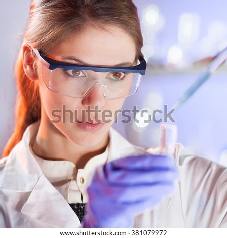 Similar – Foto Bild Nachwuchswissenschaftler pipettieren im Labor für Biowissenschaften.