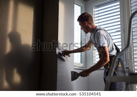 Similar – Image, Stock Photo Plasterer renovating indoor walls and ceilings.