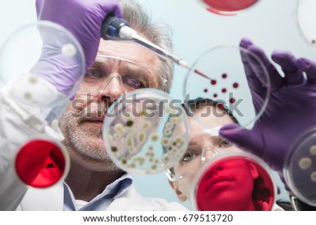 Similar – Image, Stock Photo Life science researcher grafting bacteria.