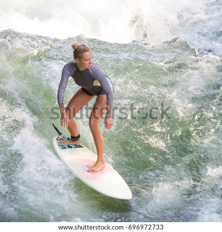 Similar – Image, Stock Photo Atractive sporty girl surfing on famous artificial river wave in Englischer garten, Munich, Germany.