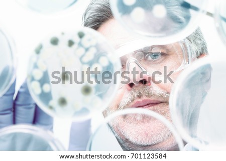 Similar – Image, Stock Photo Life science researcher grafting bacteria.