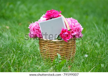 beautiful bouquet of pink peony and notepad with text \
