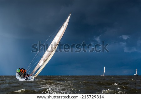 Sailing yacht going before storm