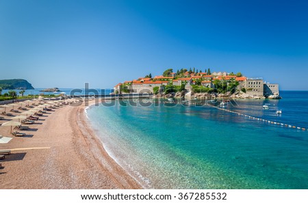 Sveti Stefan luxury touristic resort with historical village on the island and paradise Adriatic sea sand beach. Budva, Montenegro. Stock foto © 