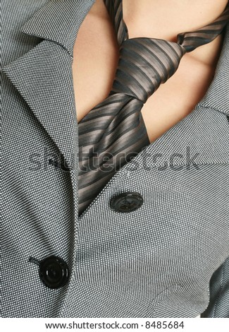 business concept, detail of a business woman suit with a tie