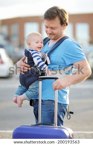 Middle age father with his little son outdoors