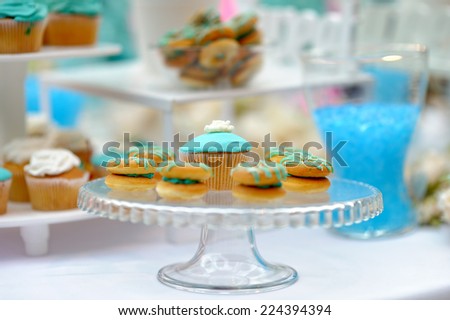 Delicious wedding cupcakes on glass dish