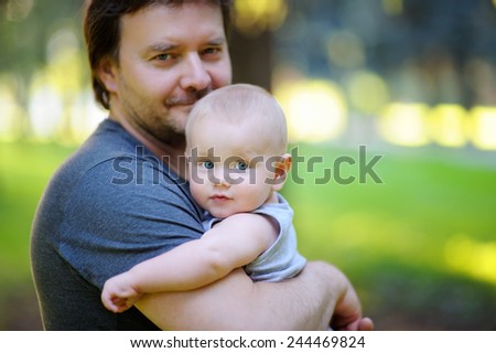 Portrait of middle age father with his little son