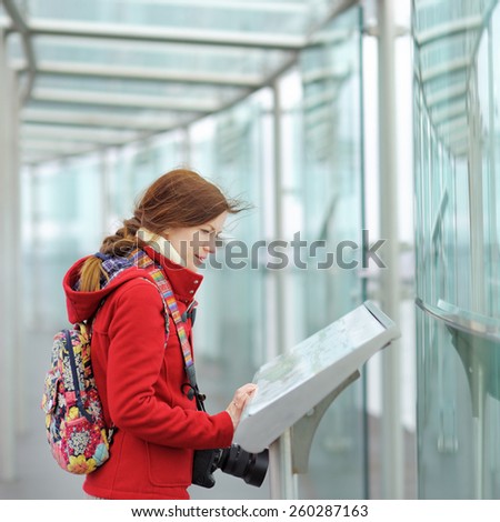 Young beautiful woman on observation deck in Montparnasse building in Paris, France