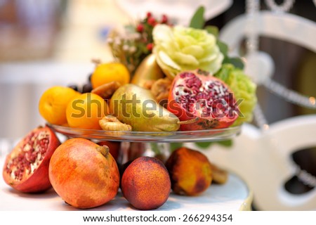 Glass dish with assortment fruits as decoration on event party or wedding reception