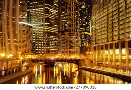 Chicago at night. Image of Chicago downtown and Chicago River with bridge at night.