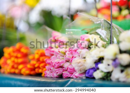 Beautiful cut flowers sold on outdoor flower shop in Paris, France