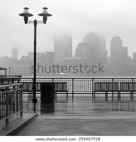 Black and white photo of New York City skyline on a rainy day