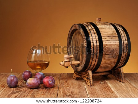 Wooden barrel, and plum brandy in a glass