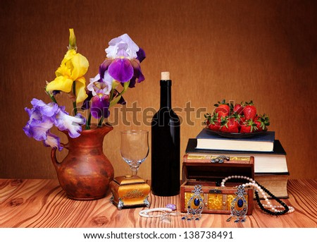 Flowers, jewelry and books on the table
