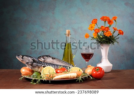 Mackerel fish with vegetables and wine on the table