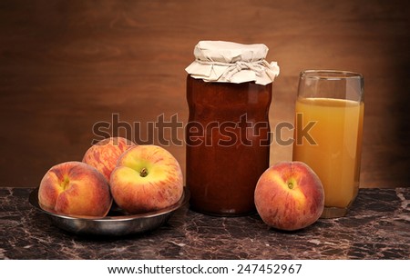 Fresh peach jam and juice on the table