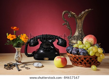 Old phone and fruits