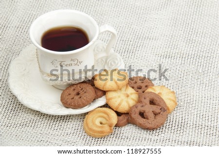 Lots of cookies on Food and Drink theme/Image of black tea cup with yummy biscuits