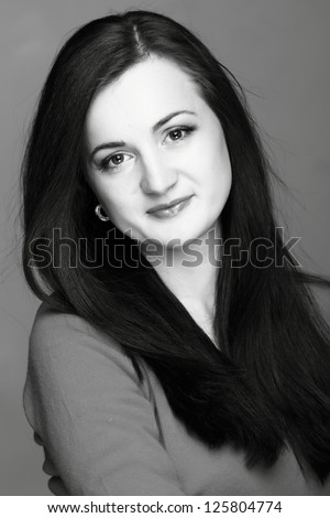 Studio image of black and white portrait pretty woman on Beauty and Fashion theme/Female portrait of a young smiley beautiful european woman
