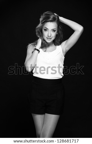 Studio Black and White image of beautiful ukrainian model in vogue style/Young blonde woman posing on Beauty and Fashion theme