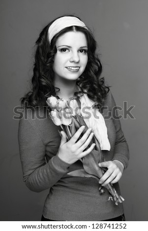 Black and White image of cute girl/Happy young girl with a bouquet of spring flowers