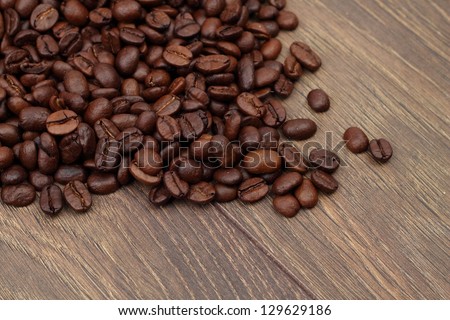 Coffee beans for spa treatments for health and beauty of the body on a wooden background
