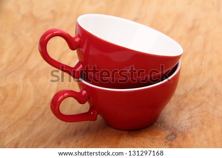 Two red coffee cups on Food and Drink