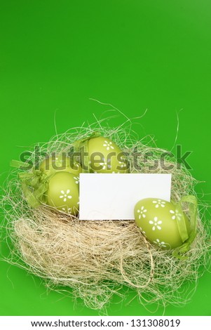 Easter basket with colored eggs and blank space for text on Holiday