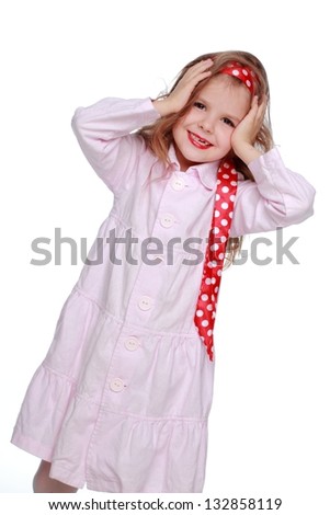 Positive little girl in the image of the girl of the sixties on white background on Holiday
