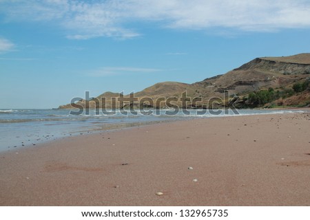 The sea coast in Crimea/Sea of ??Azov and the bright blue sky