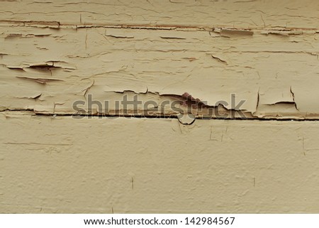Texture of old paint on a light wooden fence/Old wooden planks with cracked paint