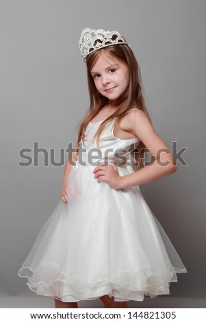 European Cute Young Girl Wearing A Crown And A White Dress With A Cute ...