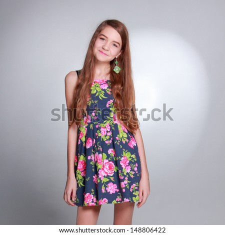 Pretty girl with long brown hair and clean skin on Health and Wellness theme/Cute young woman on Beauty and Fashion theme
