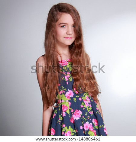 Pretty girl with long brown hair and clean skin on Health and Wellness theme/Cute young woman on Beauty and Fashion theme